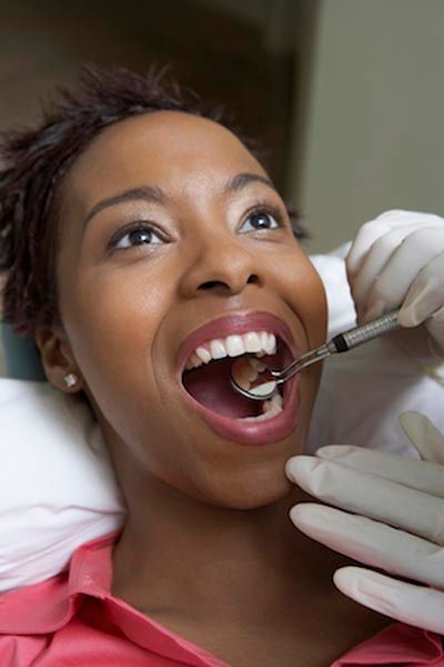 patient receiving a dental filling at Lynn Dental Care