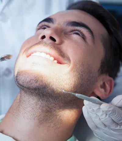 patient receiving periodontal treatment at Lynn Dental Care in Dallas, TX