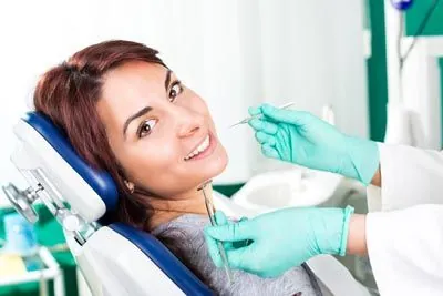 patient smiling during her holistic dental appointment