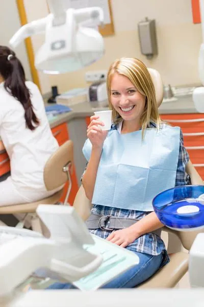 patient about to take a sedative prior to her dental procedure